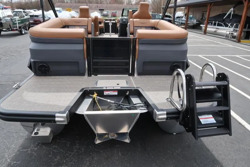 Slide: The Image of 2025 Bennington M Quad Bench 24 MFB pontoon boat, rear view with ladder and seating. - 11