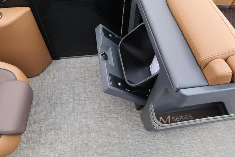 Slide: The Image of 2025 Bennington M Quad Bench 24 MFB with storage compartment open. - 14