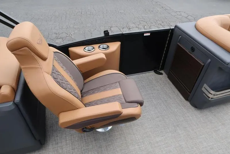 Slide: The Image of Luxurious seating on 2025 Bennington M Quad Bench 24 MFB boat, featuring cup holders. - 19