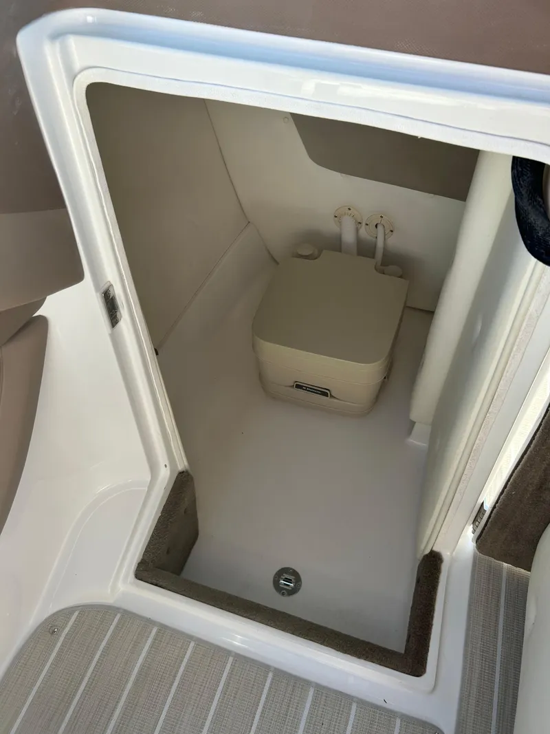 Slide: The Image of 2008 Cobalt 272 boat interior with compact marine toilet. - 11