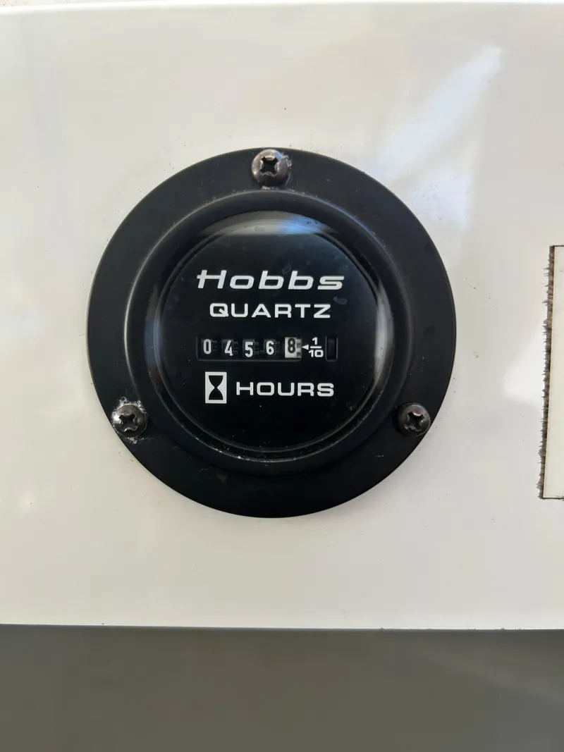 Slide: The Image of Hobbs Quartz hour meter displaying 456.8 hours on a 2008 Cobalt 272. - 16