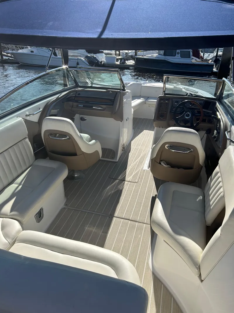 Slide: The Image of Interior of a 2008 Cobalt 272 boat with beige and white seating. - 3