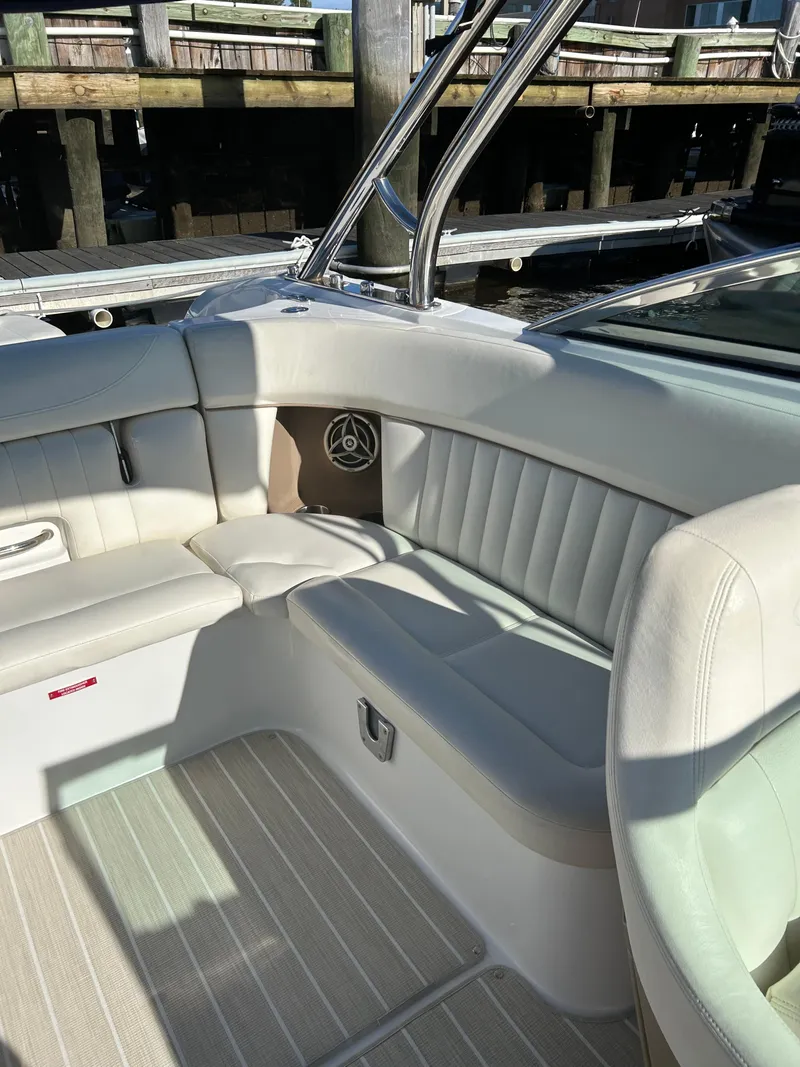 Slide: The Image of Luxurious interior of a 2008 Cobalt 272 boat with white leather seating. - 4