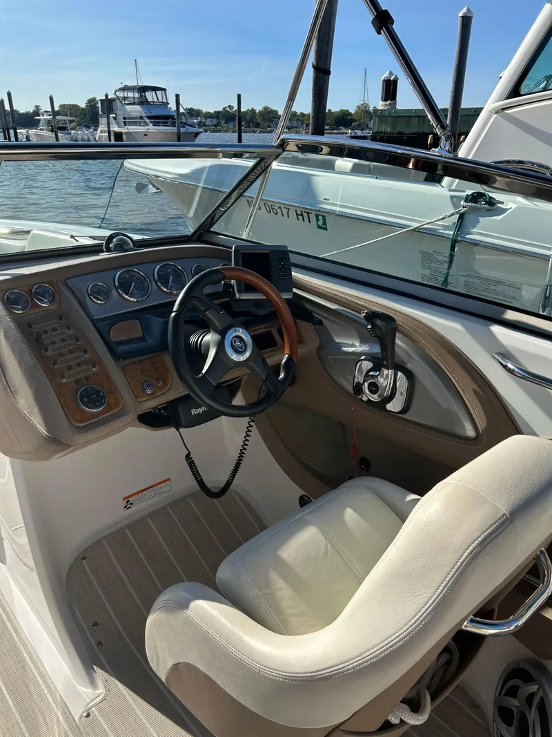 Slide: The Image of 2008 Cobalt 272 boat cockpit with steering wheel and control panel at marina. - 6