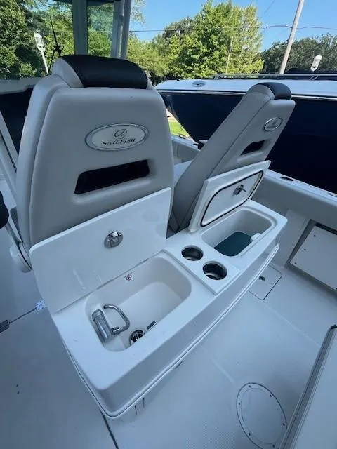 Slide: The Image of 2023 Sailfish 272 CC boat interior with seating and storage compartments. - 11