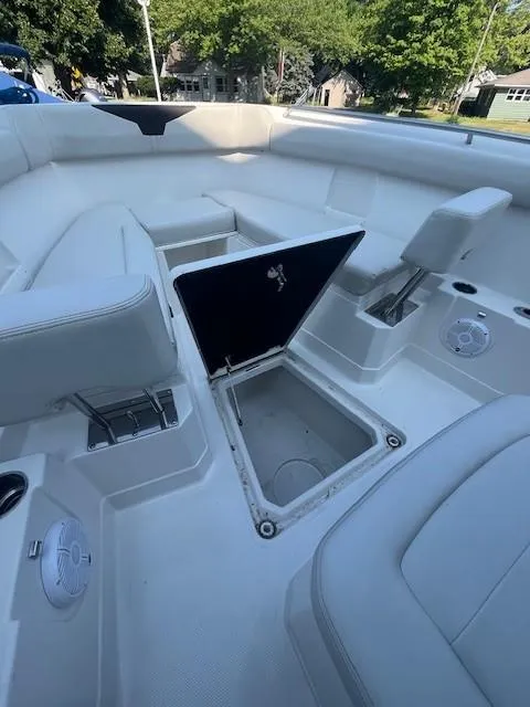 Slide: The Image of 2023 Sailfish 272 CC boat interior with open storage compartment and seating. - 13