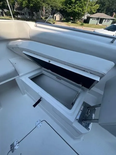 Slide: The Image of 2023 Sailfish 272 CC boat with open storage compartment on deck. - 14