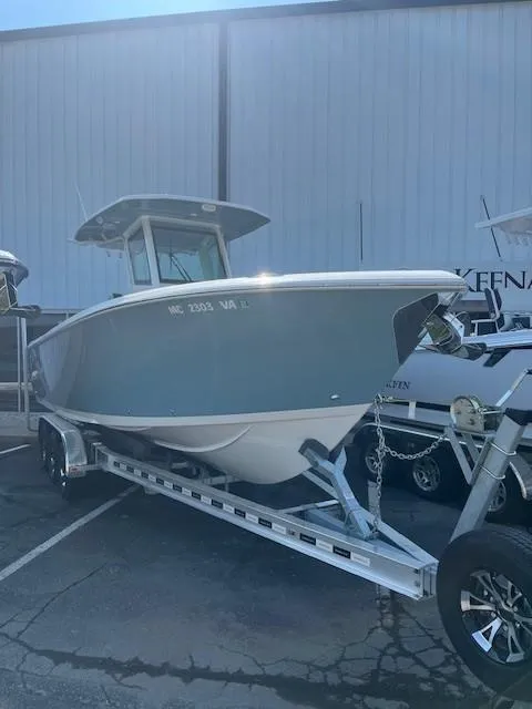 Slide: The Image of 2023 Sailfish 272 CC boat on trailer, parked outdoors. - 3