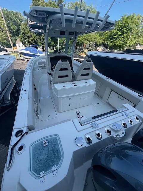 Slide: The Image of 2023 Sailfish 272 CC boat with dual seats and fishing rod holders. - 5