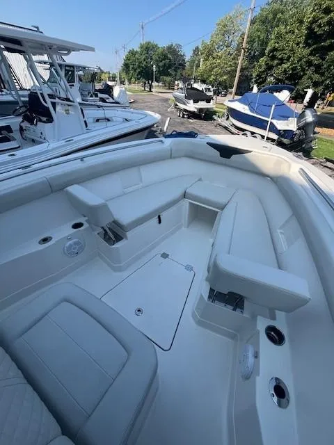 Slide: The Image of 2023 Sailfish 272 CC boat interior with spacious seating and modern design. - 9