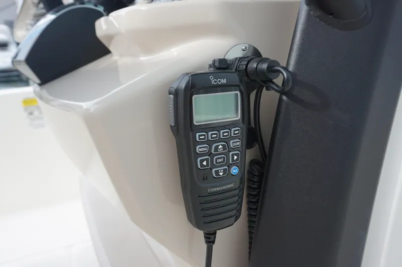 Slide: The Image of ICOM marine radio on 2026 Boston Whaler 250 Dauntless boat console. - 14