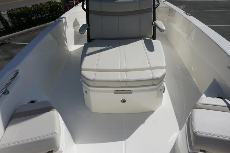 Slide: The Image of 2026 Boston Whaler 250 Dauntless boat interior with cushioned seating and sleek design. - 17