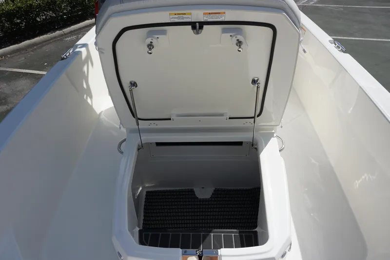 Slide: The Image of Open storage compartment on 2026 Boston Whaler 250 Dauntless boat. - 19