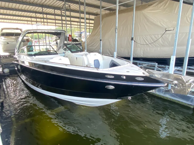 Slide: The Image of 2012 Monterey 328SS boat docked in covered marina. - 2