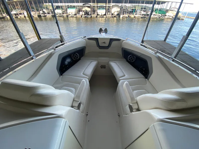 Slide: The Image of 2012 Monterey 328SS boat interior with white seating, docked at marina. - 20