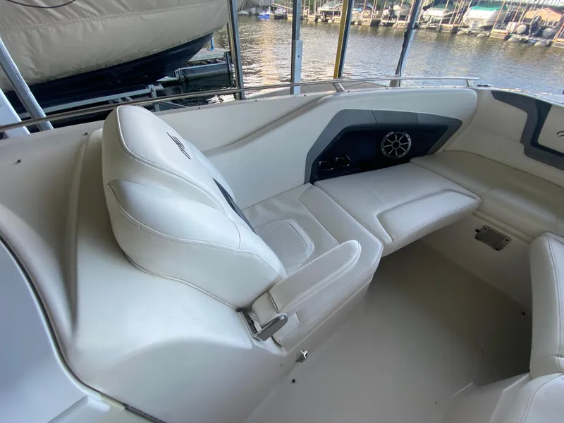 Slide: The Image of Interior of a 2012 Monterey 328SS boat with white seating and speaker system. - 21