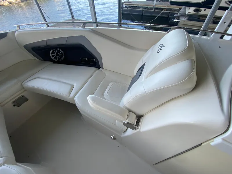 Slide: The Image of Interior of 2012 Monterey 328SS boat with white seating and speaker. - 22