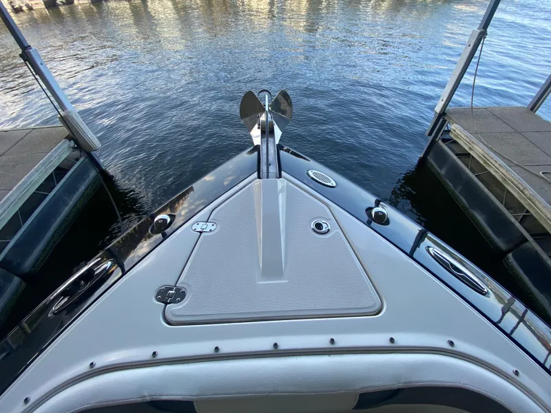 Slide: The Image of Bow view of 2012 Monterey 328SS boat docked on calm water. - 25