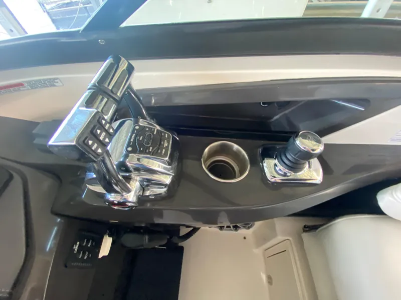 Slide: The Image of 2012 Monterey 328SS boat controls with chrome throttle and joystick. - 28