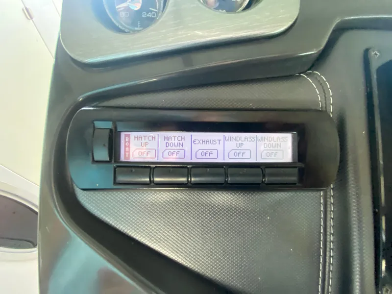 Slide: The Image of Control panel of a 2012 Monterey 328SS boat with various function buttons. - 29