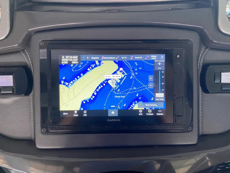 Slide: The Image of Garmin navigation system on 2012 Monterey 328SS boat dashboard displaying nautical map. - 30