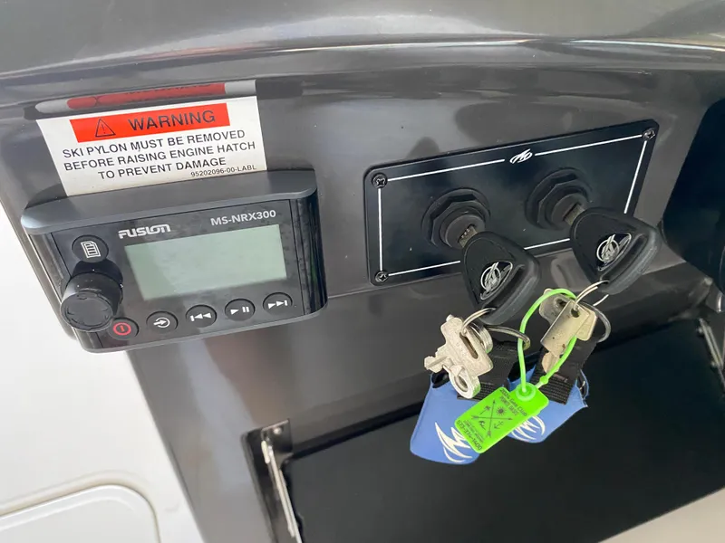 Slide: The Image of Control panel of a 2012 Monterey 328SS boat with keys and warning label. - 31