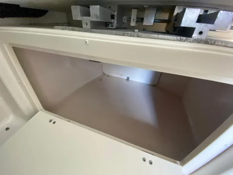 Slide: The Image of Open storage compartment in a 2012 Monterey 328SS boat. - 33