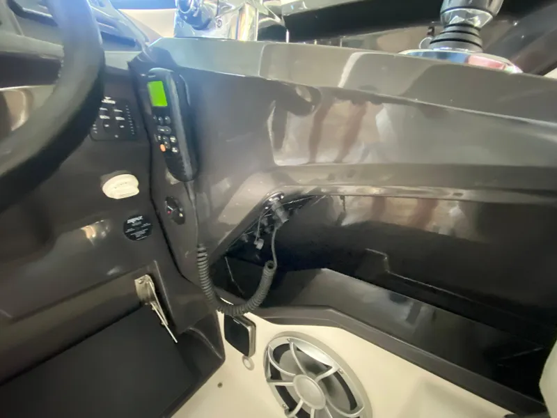 Slide: The Image of Interior of a 2012 Monterey 328SS boat showing dashboard controls and speaker. - 34