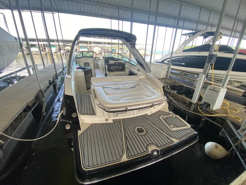 Slide: The Image of 2012 Monterey 328SS boat docked in a covered marina slip. - 38