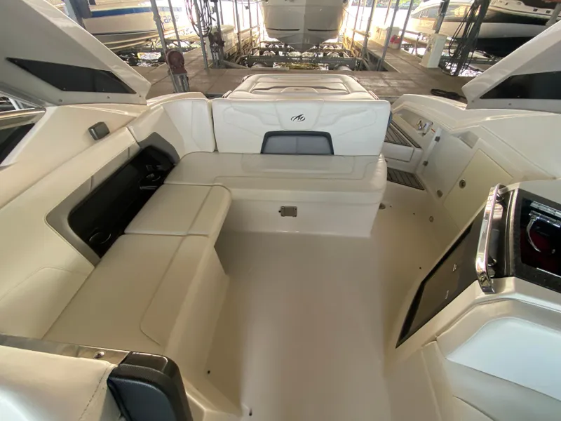 Slide: The Image of 2012 Monterey 328SS boat interior with white seating and sleek design. - 44