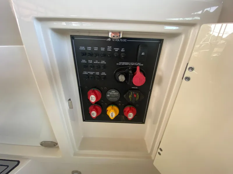 Slide: The Image of Control panel of a 2012 Monterey 328SS boat, featuring switches and dials. - 45
