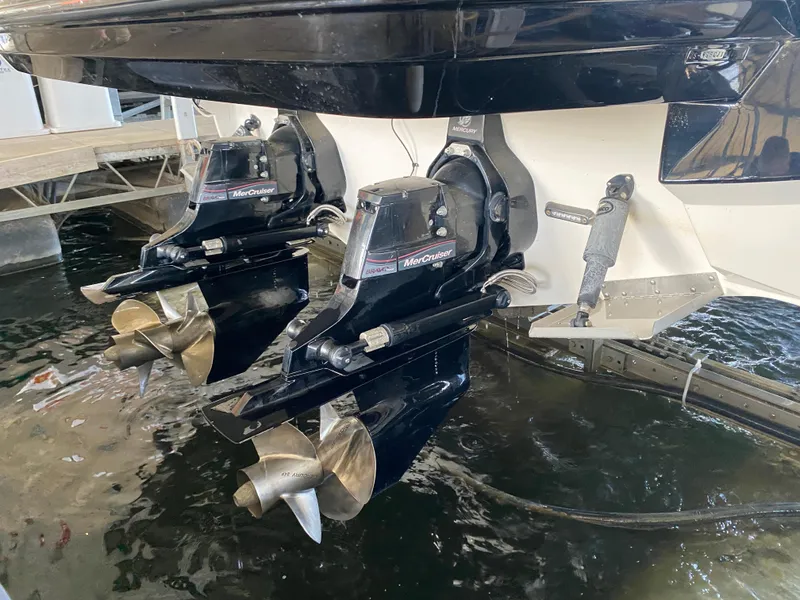 Slide: The Image of 2012 Monterey 328SS boat with dual MerCruiser outdrives in water. - 7