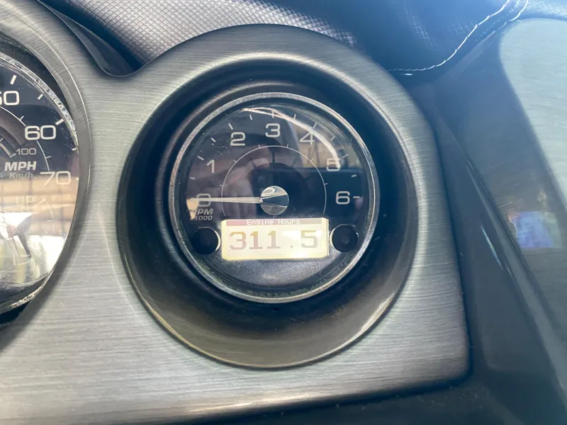 Slide: The Image of Close-up of 2012 Monterey 328SS tachometer showing 311.5 engine hours. - 8