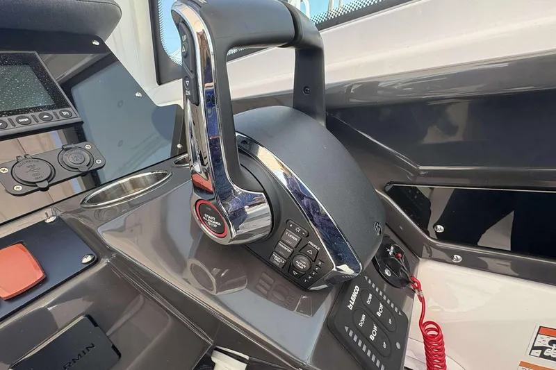 Slide: The Image of 2026 Blackfin 272 DC boat control panel with throttle and navigation buttons. - 12