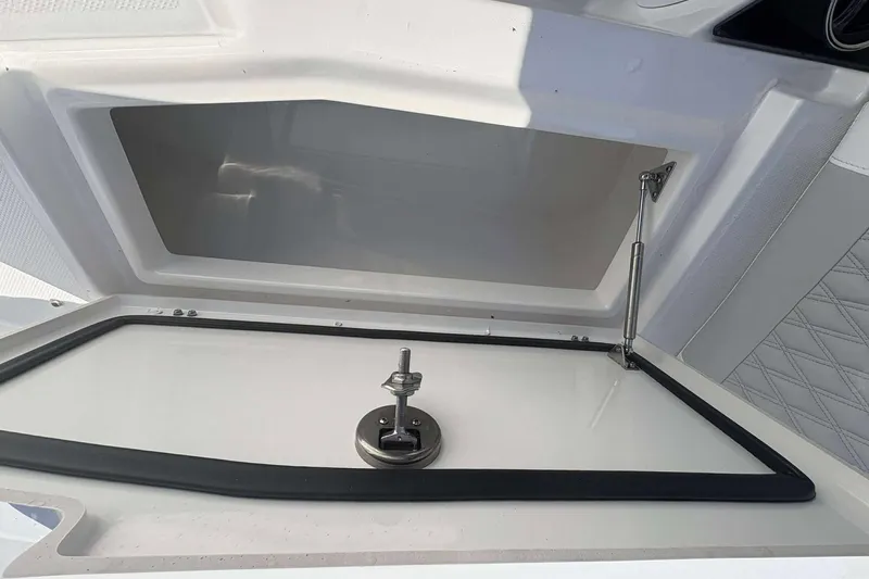 Slide: The Image of Open storage compartment on 2026 Blackfin 272 DC boat, featuring secure latch and hydraulic support. - 21