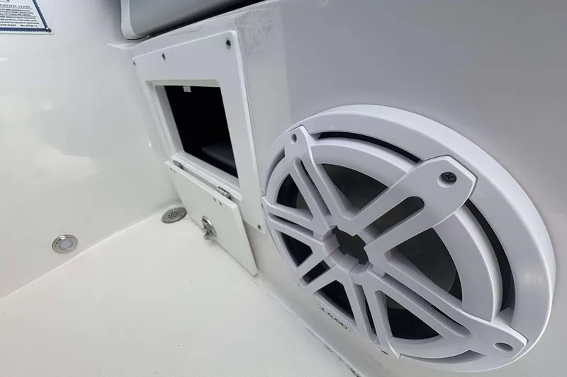 Slide: The Image of 2026 Blackfin 272 DC boat interior with speaker and storage compartment. - 25