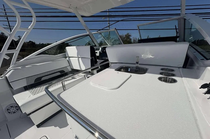 Slide: The Image of 2026 Blackfin 272 DC boat interior with seating and sink area. - 7