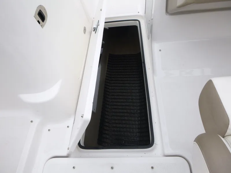 Slide: The Image of Open storage compartment on 2013 Yamaha SX240 HO boat deck. - 10