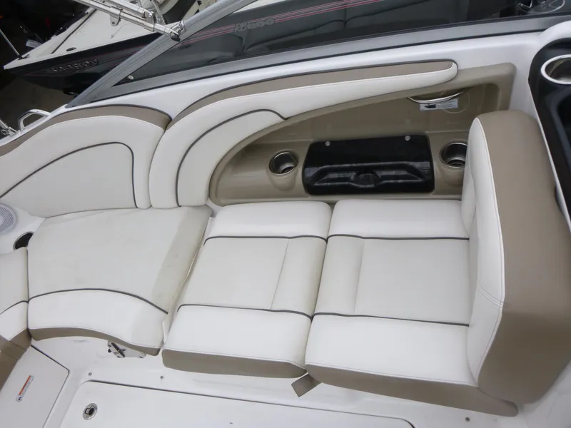 Slide: The Image of 2013 Yamaha Boats SX240 HO interior seating with beige and white upholstery. - 12