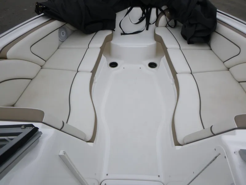 Slide: The Image of 2013 Yamaha Boats SX240 HO interior with spacious seating and cup holders. - 8