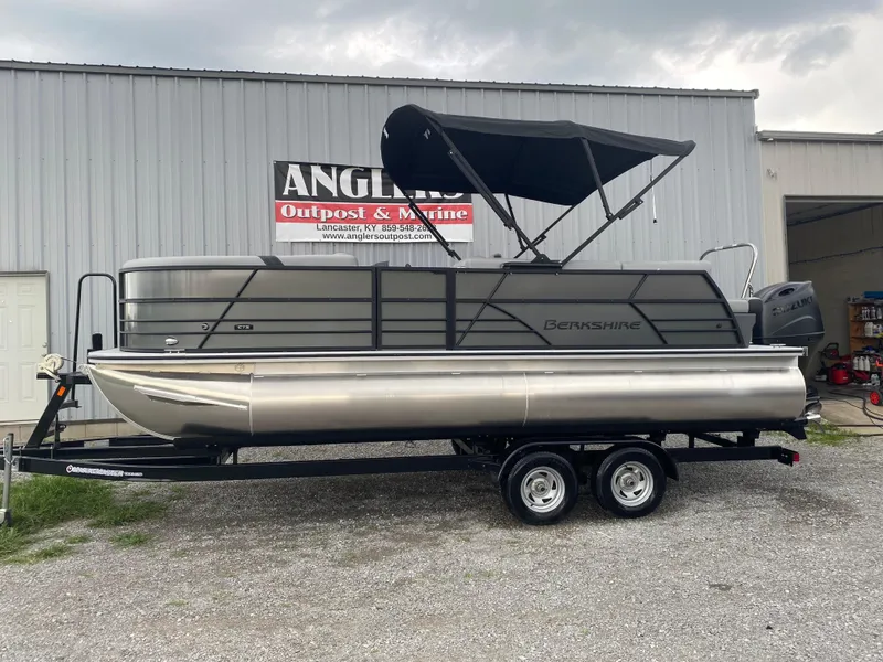 Slide: The Image of 2025 Berkshire 22 CL2 pontoon boat on trailer at Anglers Outpost & Marine. - 1