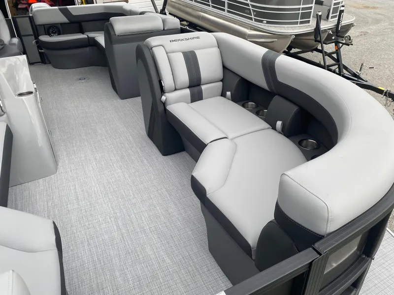 Slide: The Image of 2025 Berkshire 22 CL2 pontoon boat interior with gray seating and cup holders. - 10