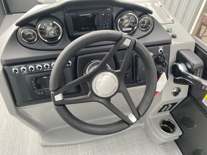 Slide: The Image of Steering console of 2025 Berkshire 22 CL2 boat with gauges and controls. - 15