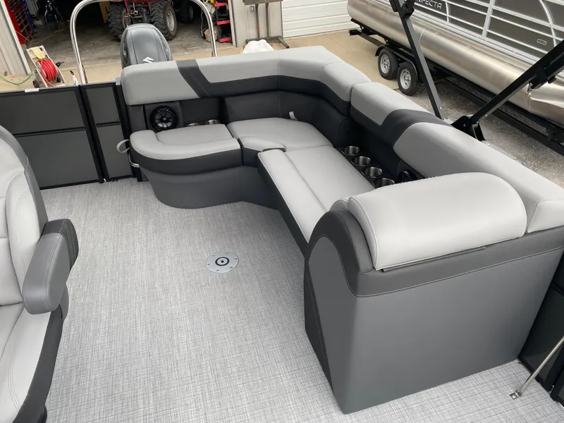 Slide: The Image of Luxurious seating area on a 2025 Berkshire 22 CL2 pontoon boat, featuring gray upholstery. - 17