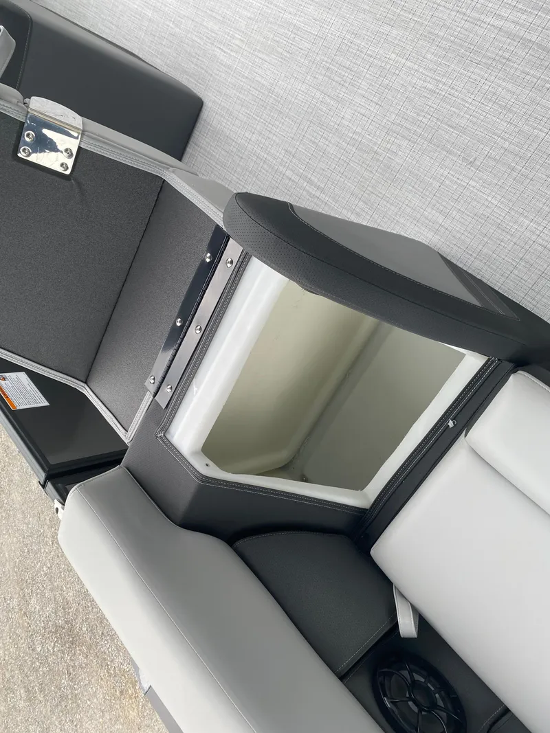 Slide: The Image of 2025 Berkshire 22 CL2 boat seat with open storage compartment. - 18