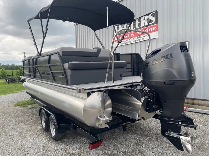 Slide: The Image of 2025 Berkshire 22 CL2 pontoon boat with Suzuki outboard motor on trailer. - 6