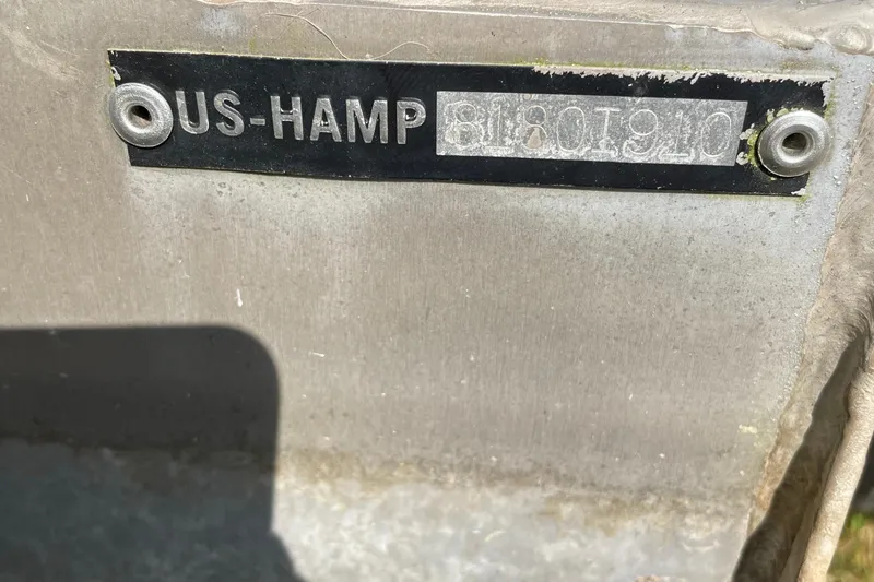 Slide: The Image of 2010 Harris Grand Mariner 240 pontoon boat interior with beige seating and canopy. - 11