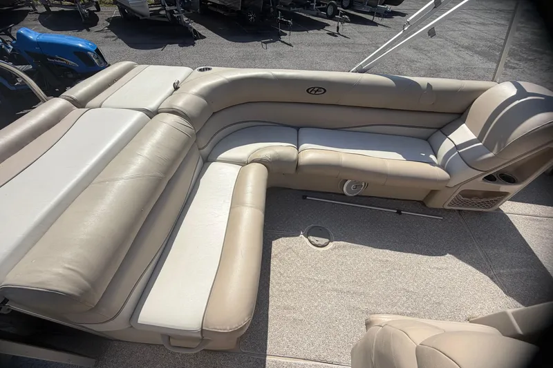 Slide: The Image of 2010 Harris FloteBote 240 Grand Mariner with beige leather seating on deck. - 21