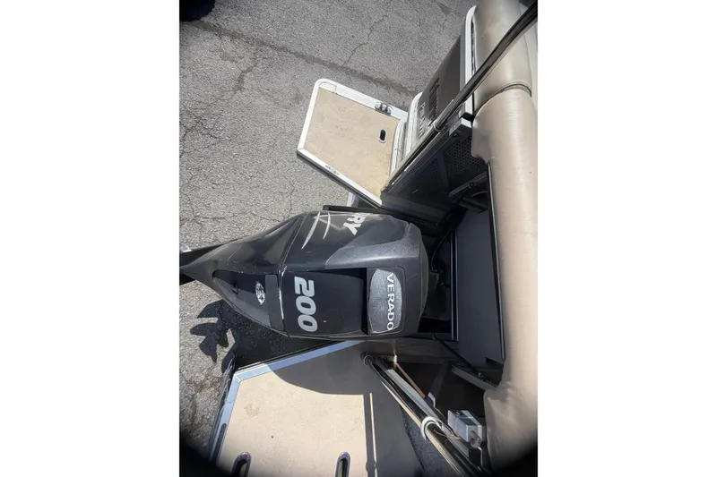 Slide: The Image of 2010 Harris FloteBote 240 Grand Mariner with Verado 200 engine, docked on pavement. - 23