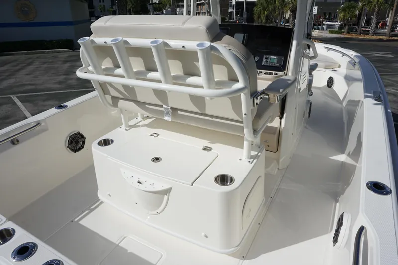 Slide: The Image of 2026 Boston Whaler 220 Dauntless boat interior with seating and storage features. - 13